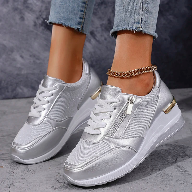 Women's metallic orthopaedic platform trainers, featuring a side zip, lace-up design for adjustable comfort.
