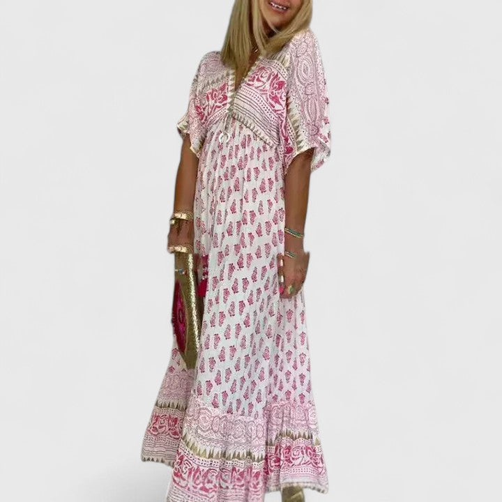 Elegant women's boho print flowy maxi dress, perfect as a comfortable summer vacation dress or stylish beach cover-up.