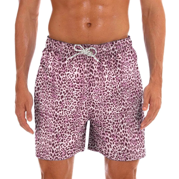 Comfortable men's quick-dry swim shorts with vibrant paisley print, perfect for vacation & resort wear.