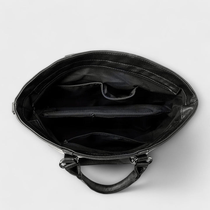 Chic women's large black leather shoulder bag, a timeless handbag for everyday sophistication.