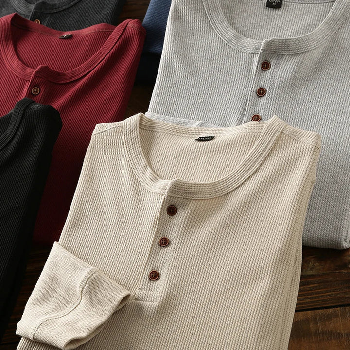 Breathable men's waffle knit henley shirt, a versatile and comfortable top for any occasion.