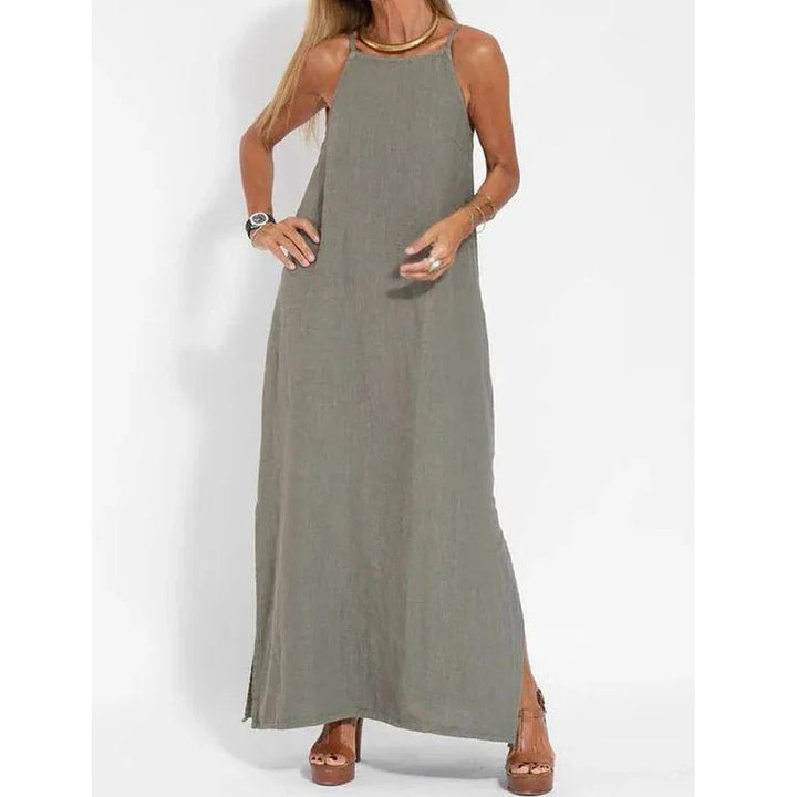 Stylish women's elegant maxi slip dress with flattering side slits, perfect for a chic summer or evening look.