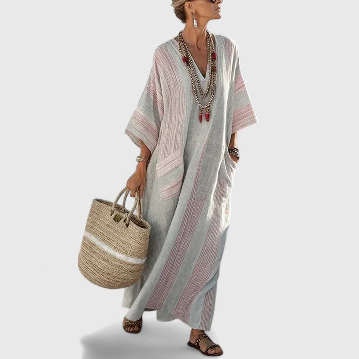 Vacation-ready women's bohemian maxi dress, elegant flowy V-neck for summer beach holidays.