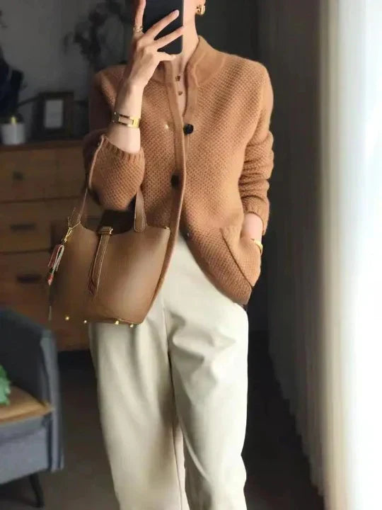Fashionable women's warm cardigan. Elegant, comfortable long-sleeve sweater, ideal for versatile layering.