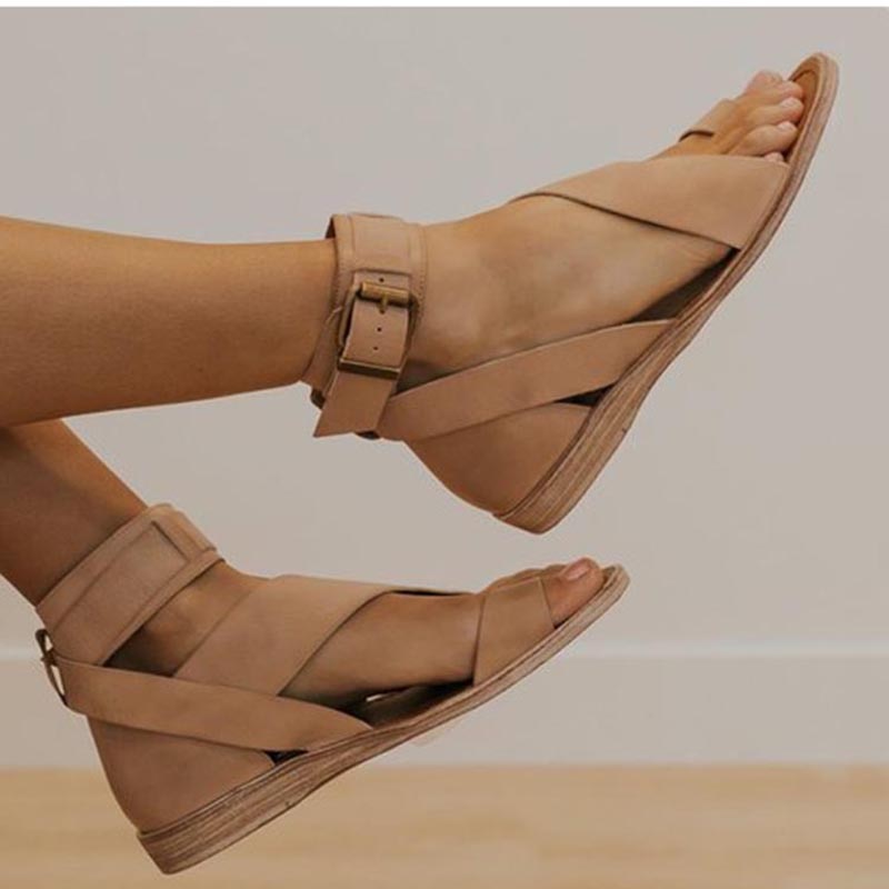 Casual & elegant women's beach sandals featuring supportive cross strap and chic toe ring.
