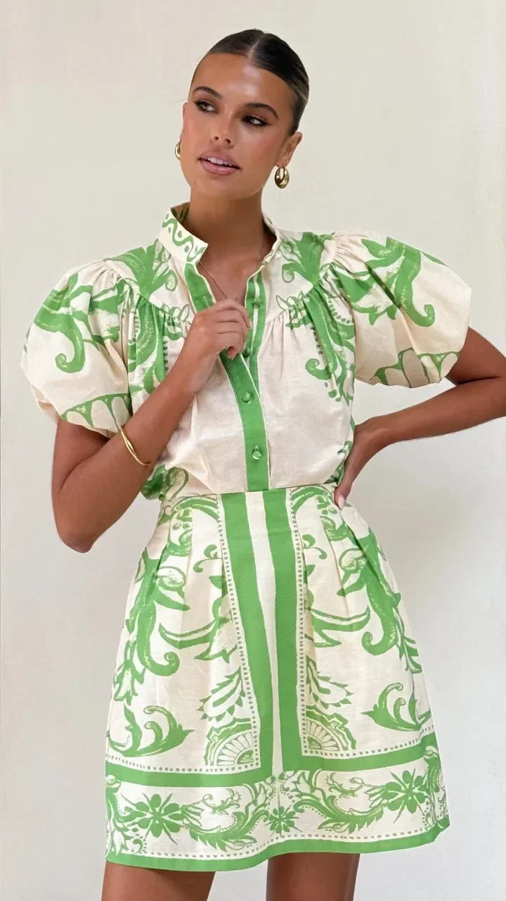 Playful floral women's mini dress with puff sleeves, ideal for warm spring days.