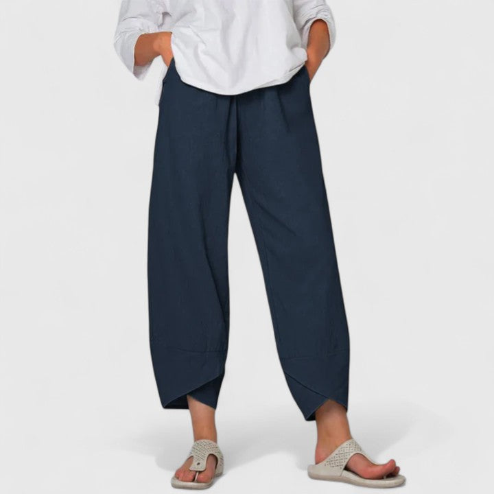 Chic women's wide-leg trousers, offering stylish comfort and an elegant, versatile look with pockets.