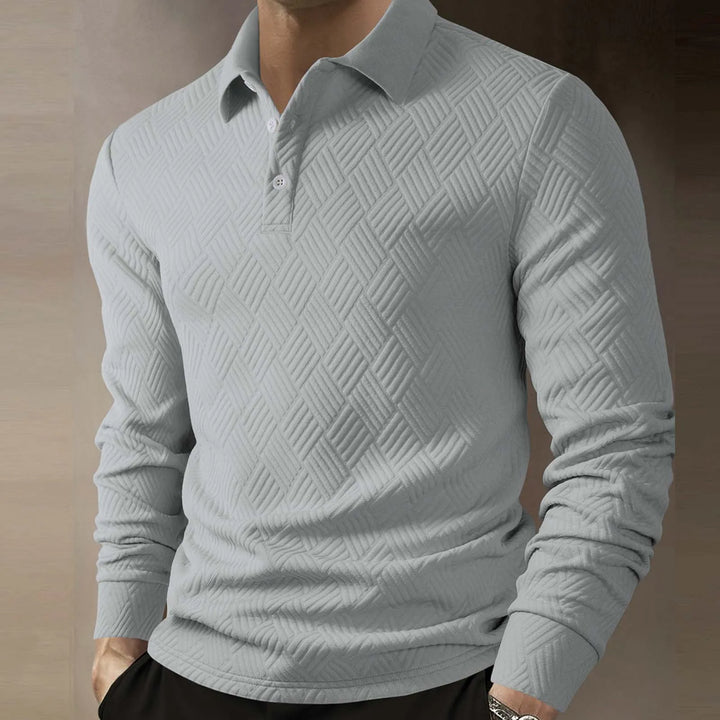 Stylish men's long sleeve polo with a unique textured knit pattern, featuring a classic button collar.