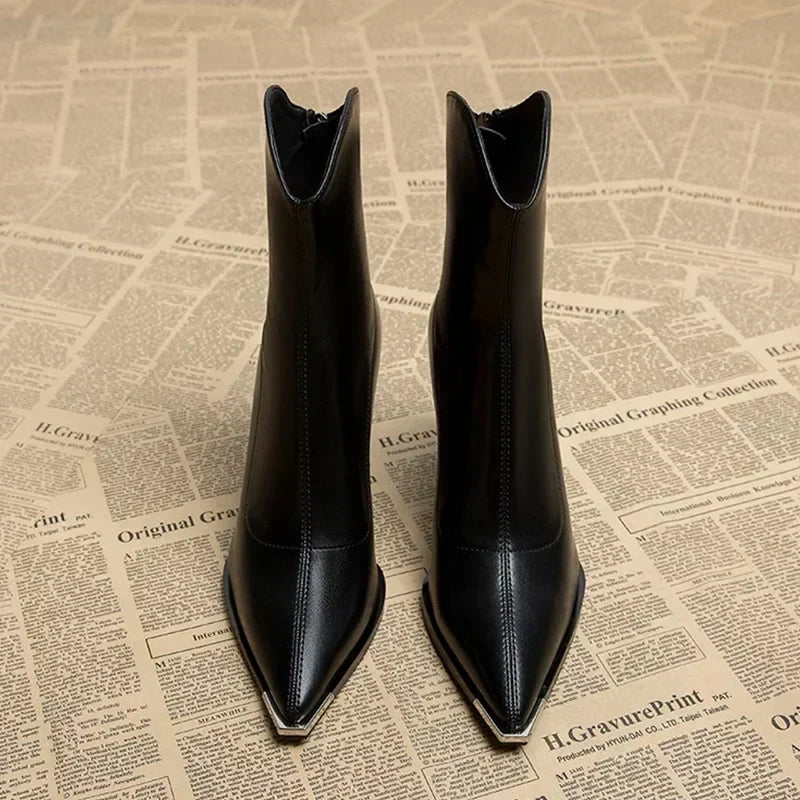 Brown women's ankle boots with a chic chrome tip, ideal for fashion-forward and elegant outfits.