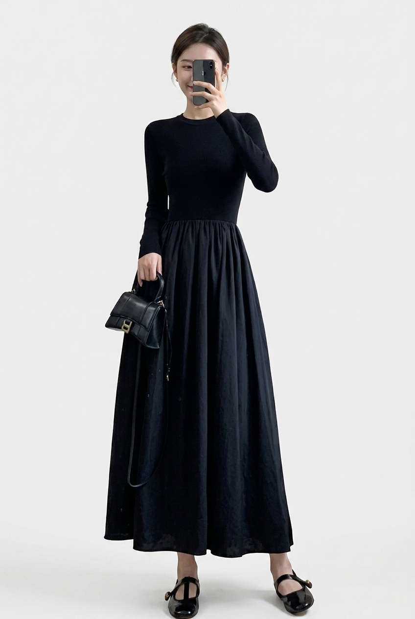 Women's elegant black high neck top & textured A-line midi skirt two-piece set for sophisticated style.