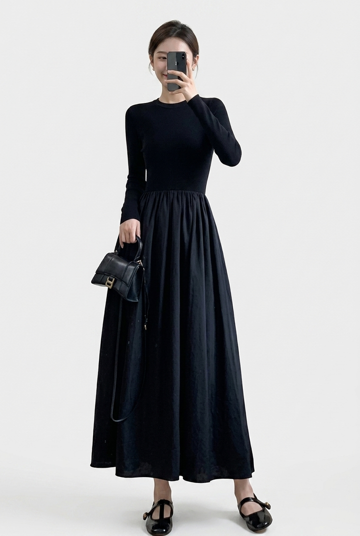 Women's elegant black high neck top & textured A-line midi skirt two-piece set for sophisticated style.