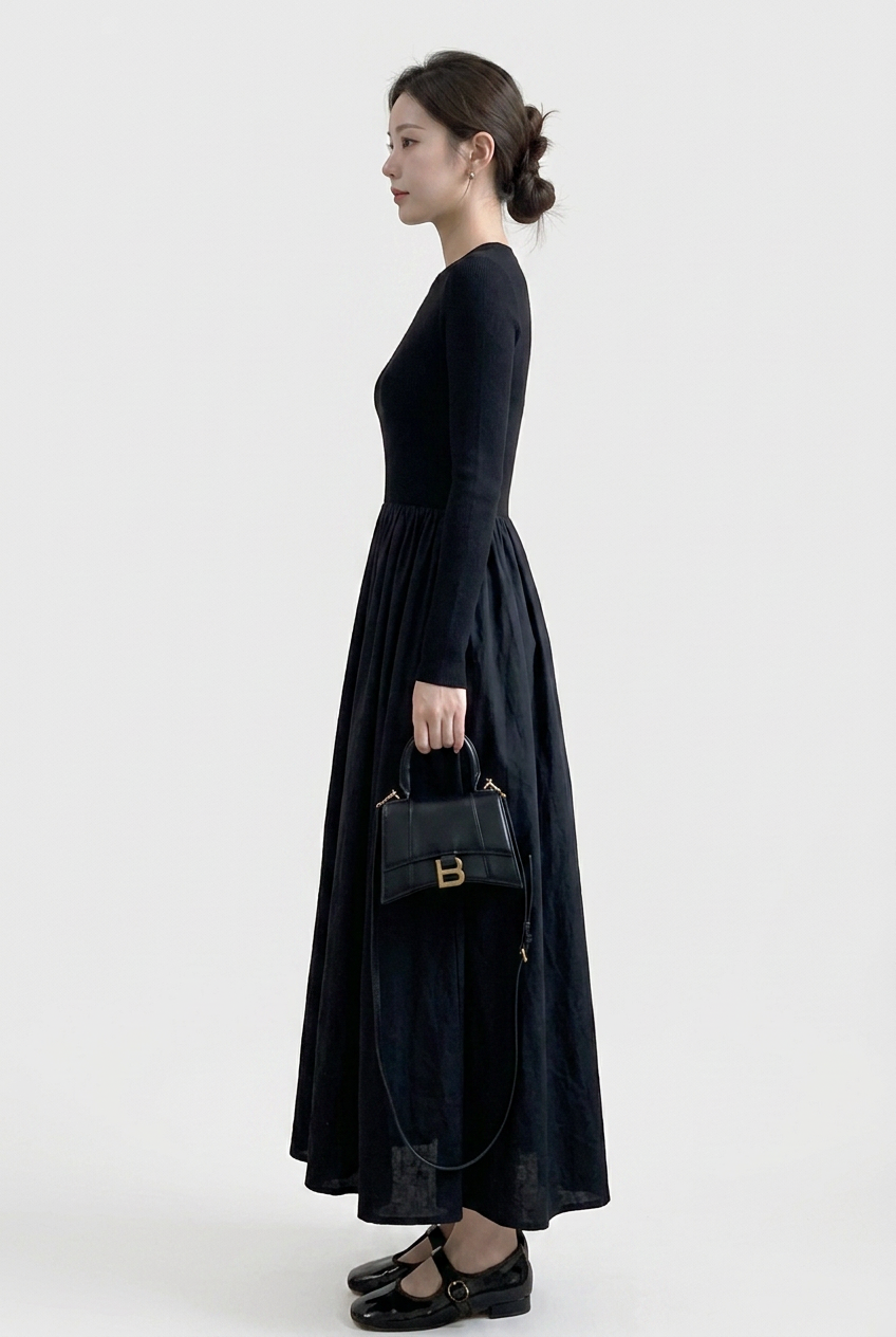 Sophisticated women's black high neck top & textured midi skirt set, perfect for work or elegant evenings.