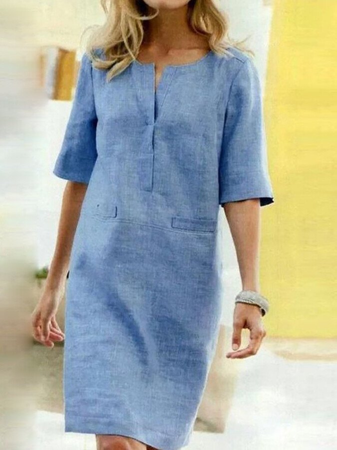 Women's relaxed fit shift dress with practical pockets, perfect for casual everyday wear & summer comfort.