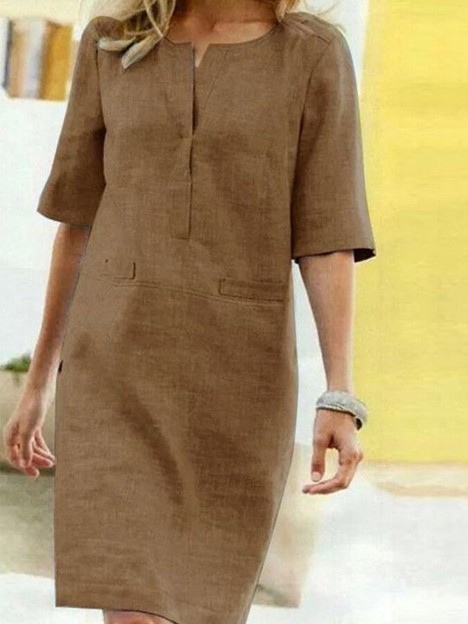 Comfortable women's day shift dress. Relaxed fit, featuring practical pockets and a simple design for summer looks.
