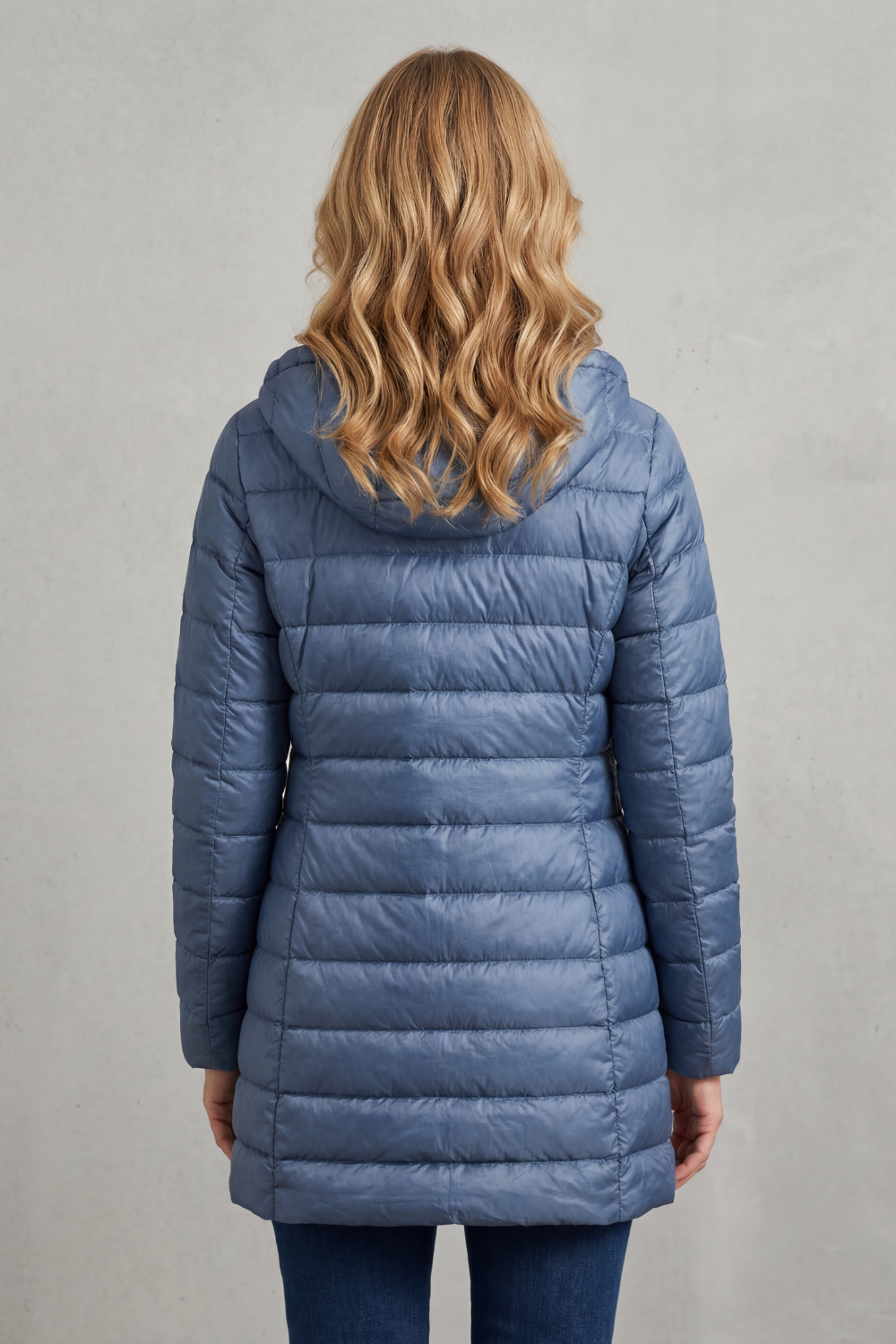 Lightweight hooded puffer jacket for women, a warm and stylish everyday essential.