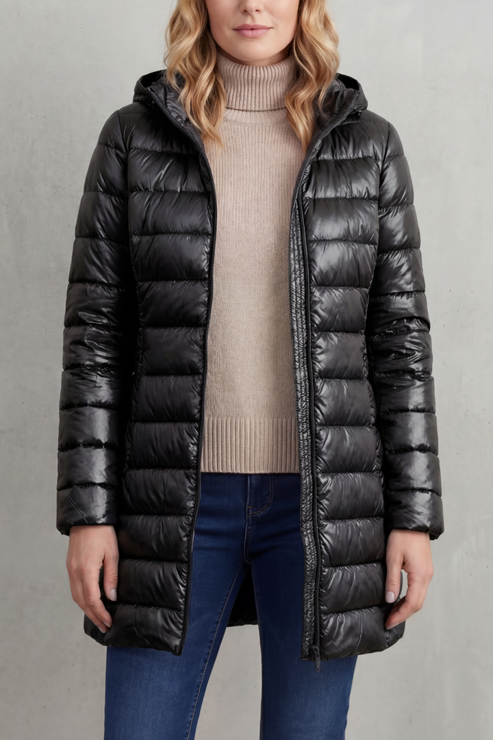 Stylish women's lightweight puffer jacket with hood, providing warmth for any occasion.