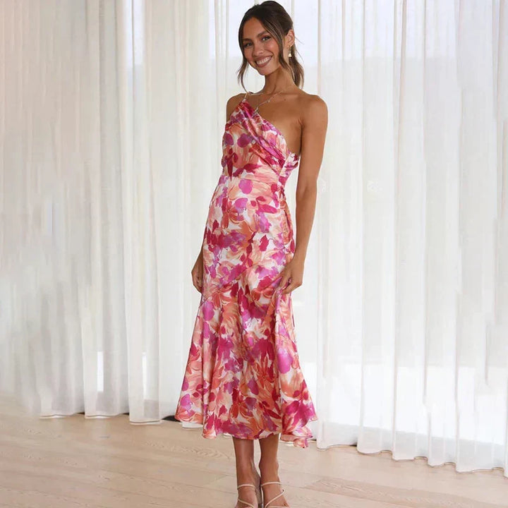 Chic pink floral asymmetrical midi dress for women. Features one shoulder design, ideal for elegant party wear.