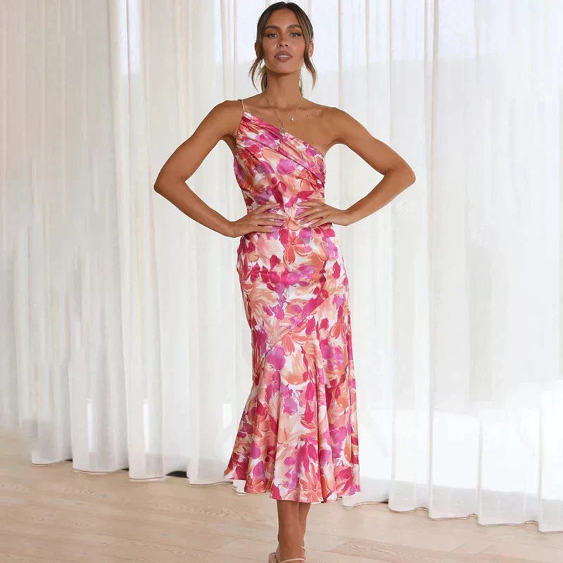 Beautiful pink floral midi dress, asymmetrical and elegant. A perfect summer party or occasion dress for women.