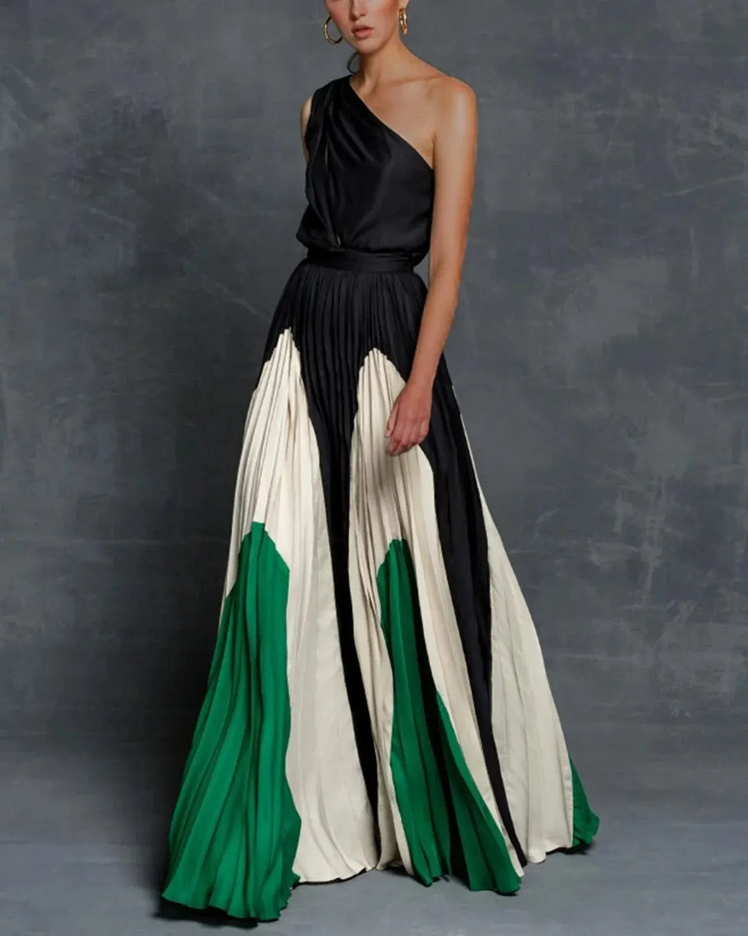 Formal women's evening wear: chic one-shoulder pleated maxi dress, perfect for wedding guests.