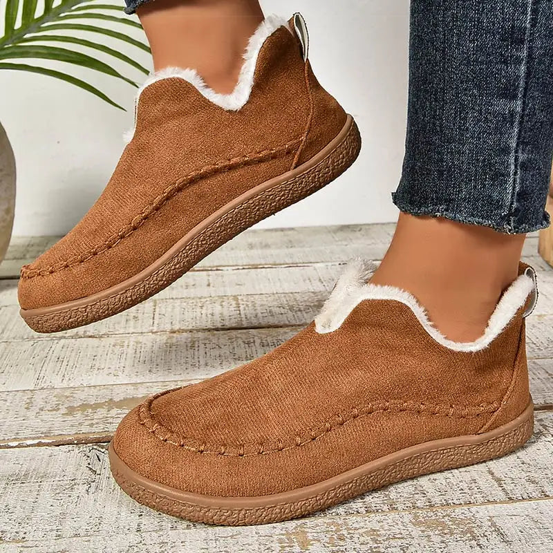 Black women's orthopaedic boots with arch support. Comfortable casual ankle boots for everyday winter style.