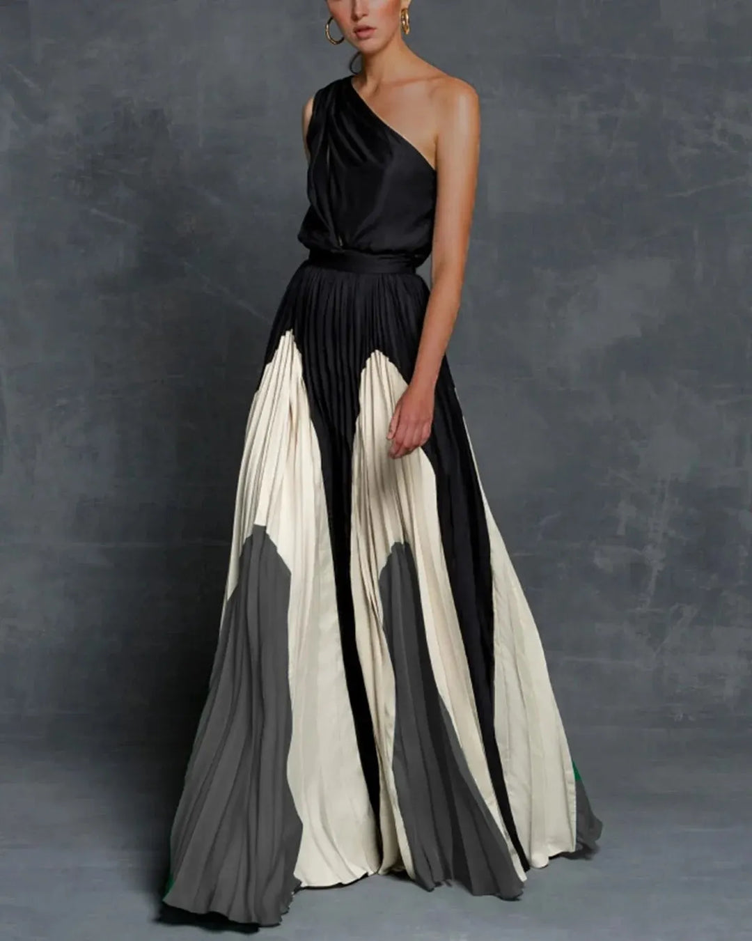 Sleeveless elegant one-shoulder pleated maxi dress for women, ideal formal evening wear for guests.