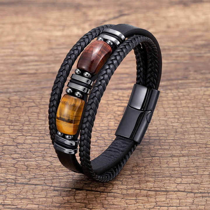 Stylish men's tiger eye bracelet, braided design on wrist for a confident everyday accessory.