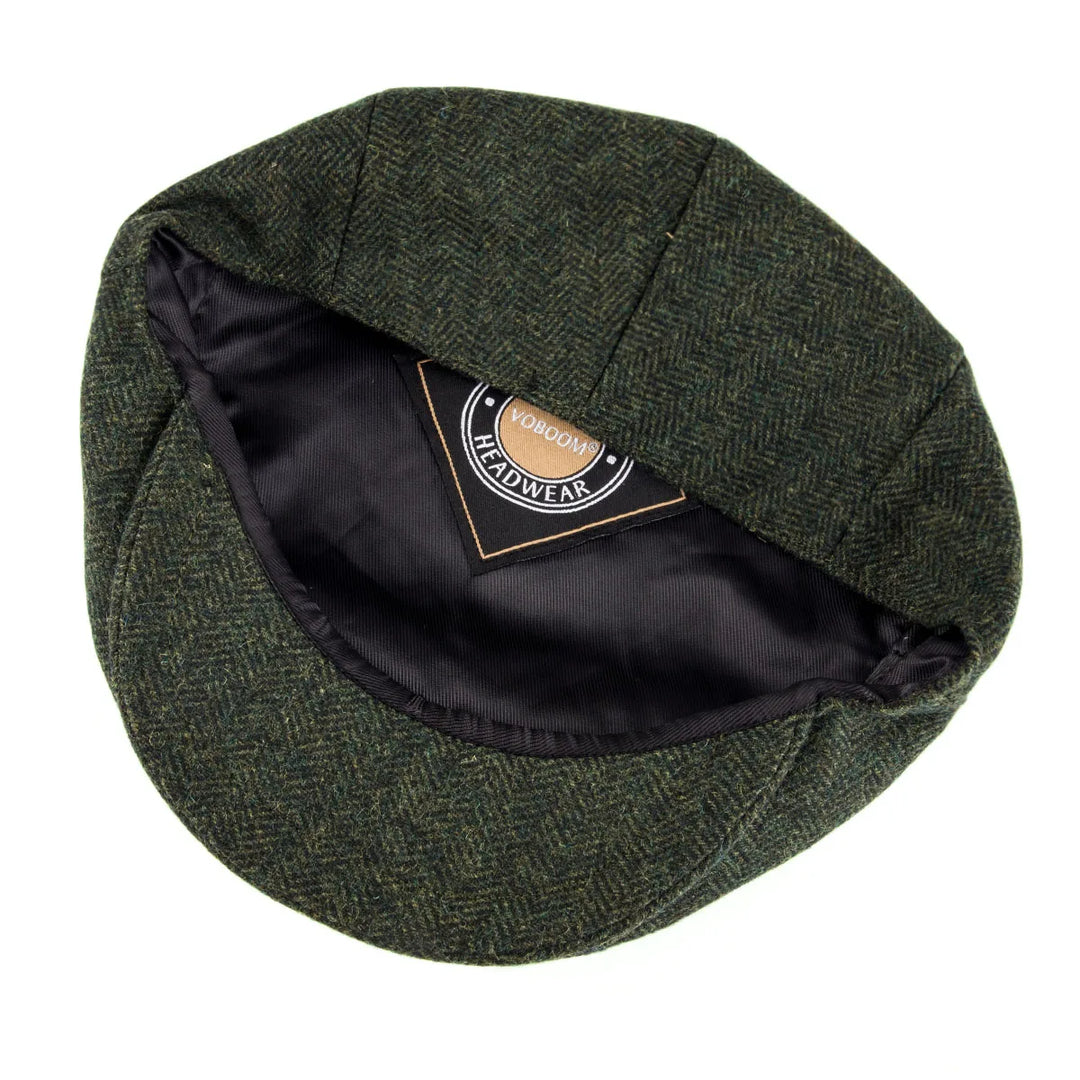 Detailed view of the brim & material of the men's classic herringbone flat cap.