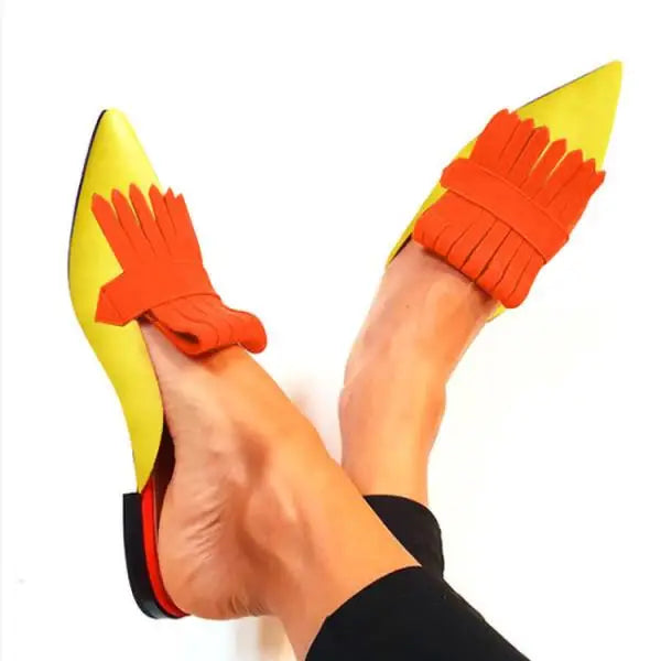 Pair of sophisticated open-back pointed-toe pumps for women, enhancing any evening or party outfit.