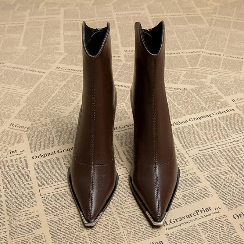 Elegant black women's ankle boots, offering sophisticated style and comfortable, versatile wear.