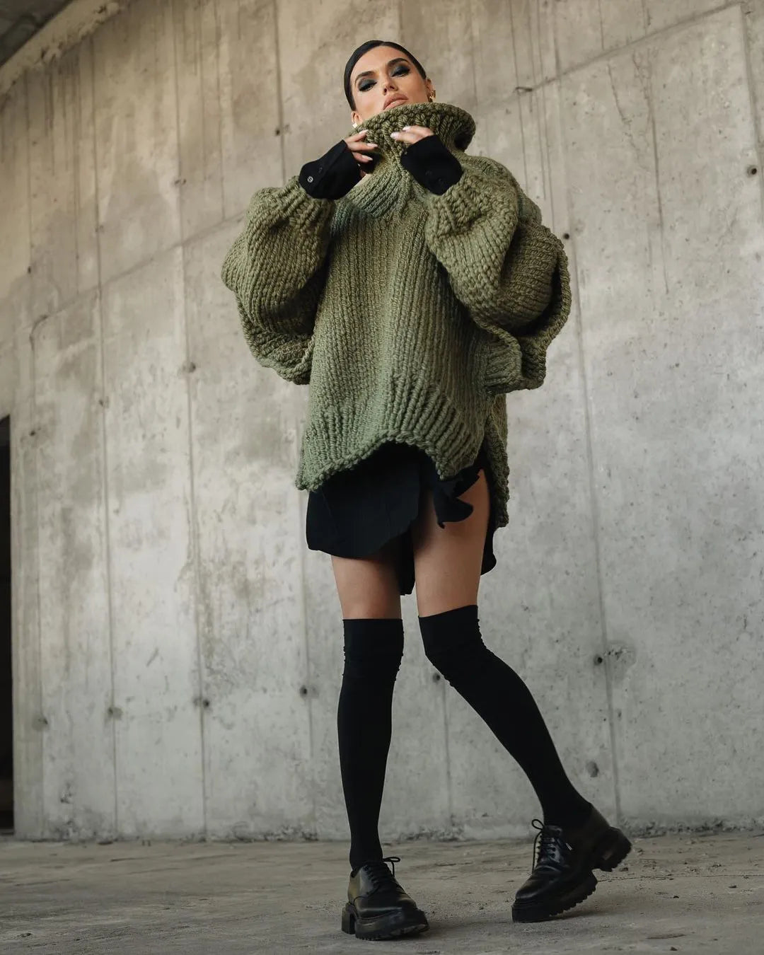 Cozy oversized turtleneck sweater dress for women, chic knit mini perfect for fall and winter comfort.