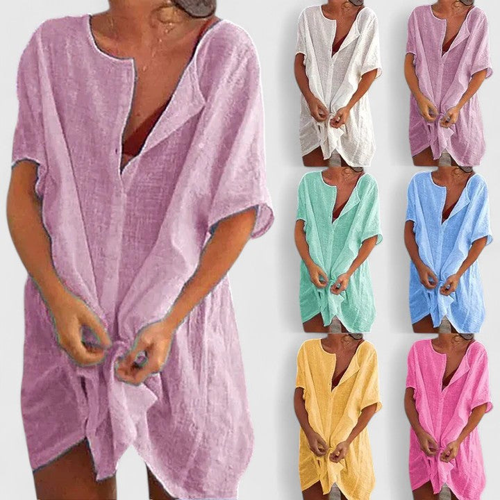 Back view of the elegant women's tunic dress, showcasing its flowing silhouette and comfortable summer design. Chic.