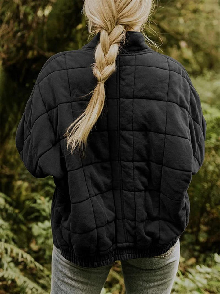 Trendy women's quilted jacket, a practical zipper outerwear piece for versatile casual looks in spring/fall.