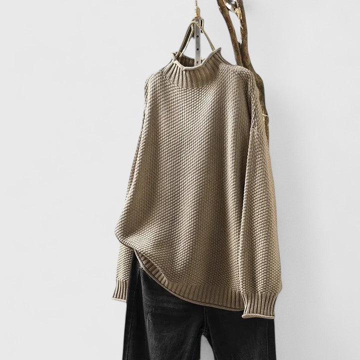 Close-up of chic women's textured knit mock neck sweater, ideal for cozy everyday fall & winter wear.