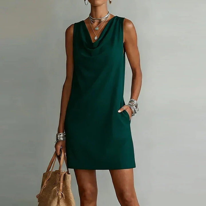 A-line women's cowl neck mini dress, perfect for casual summer wear. Sleeveless design with a flattering fit.