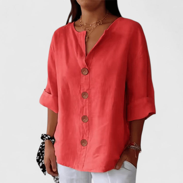 Fashionable women's V-neck blouse with a button-front, a comfortable & versatile top for elegant everyday style.