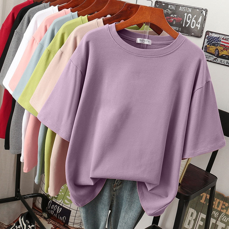 Plus-size woman in a comfy short-sleeve, round-neck t-shirt, emphasizing versatile everyday style.