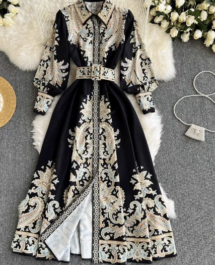 Flowy long sleeve women's maxi abaya dress, belted with intricate paisley pattern. Modest, elegant wear.
