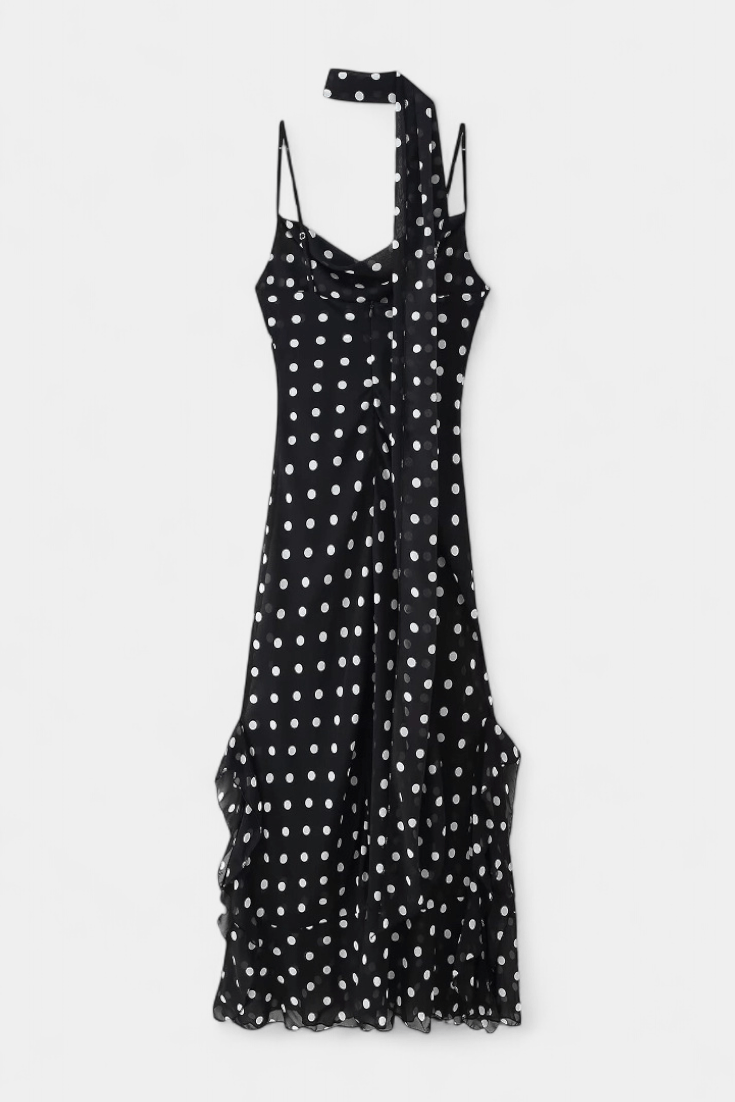 Classic women's polka dot midi dress with adjustable straps, ideal for an elegant evening outfit.