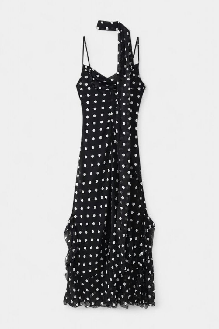 Classic women's polka dot midi dress with adjustable straps, ideal for an elegant evening outfit.