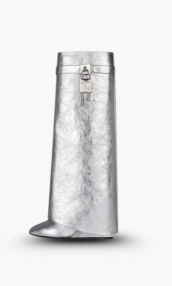 Fashion-forward women's tall boots, glossy and sculptural wedge, for sophisticated winter looks.