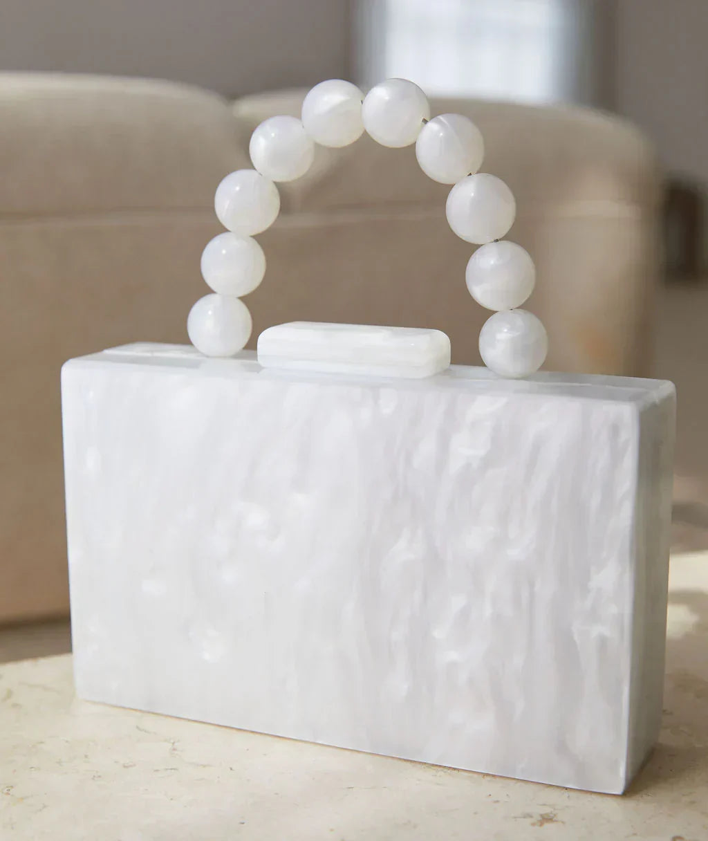 Glamorous acrylic party handbag, chic women's clutch for special occasion evenings.