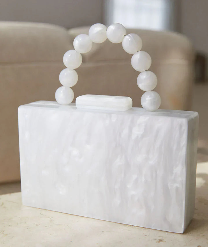 Glamorous acrylic party handbag, chic women's clutch for special occasion evenings.