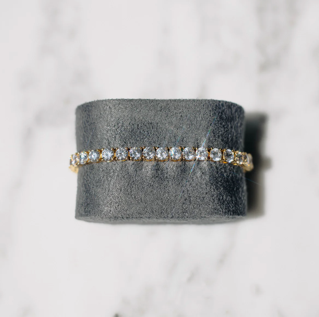Sparkling crystal tennis bracelet for women, gold-plated, featuring a classic elegant design; perfect gift for her.