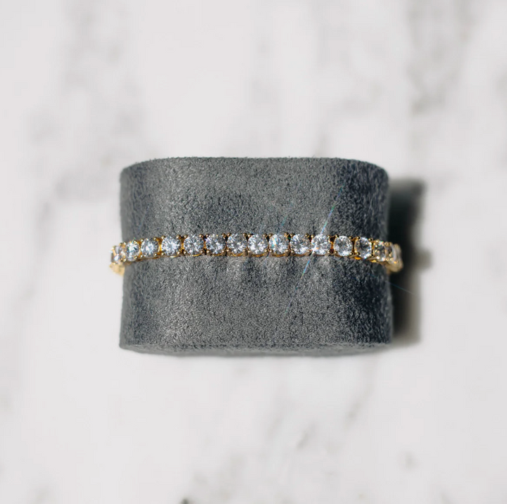 Sparkling crystal tennis bracelet for women, gold-plated, featuring a classic elegant design; perfect gift for her.