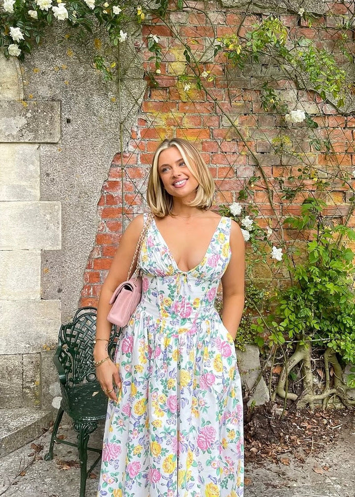 Chic women's elegant floral midi dress, designed for summer comfort and style with a flattering silhouette.
