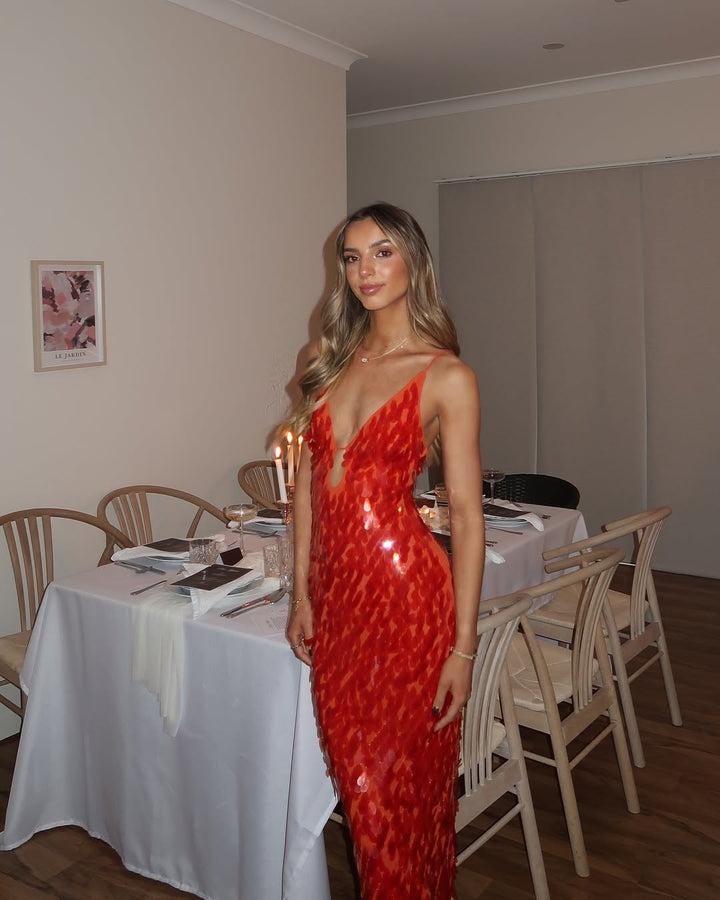 Dazzling red sequin V-neck maxi dress, a glamorous evening gown for women, mermaid silhouette.