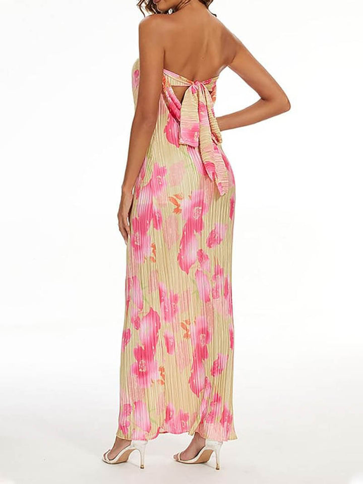 Woman wearing a chic sleeveless elegant maxi dress, embodying holiday vibes and effortless summer style.