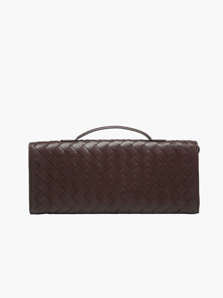 Chic women's accessory: a woven clutch bag with knot closure, perfect for any party.