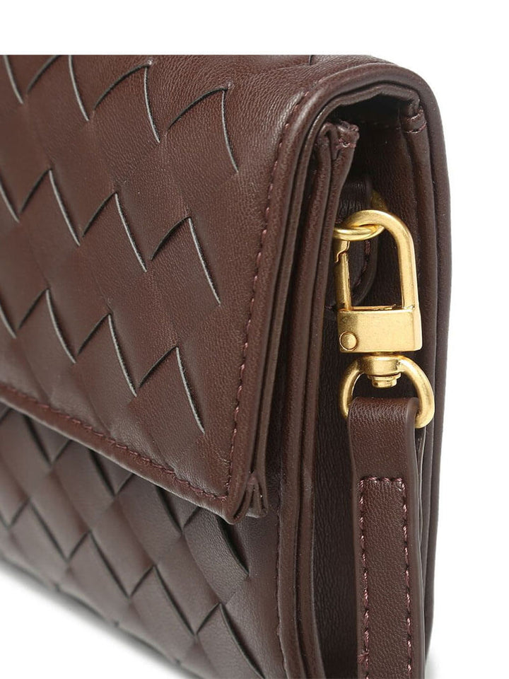 Beautifully crafted women's woven clutch, a compact evening handbag with a stylish knot closure.