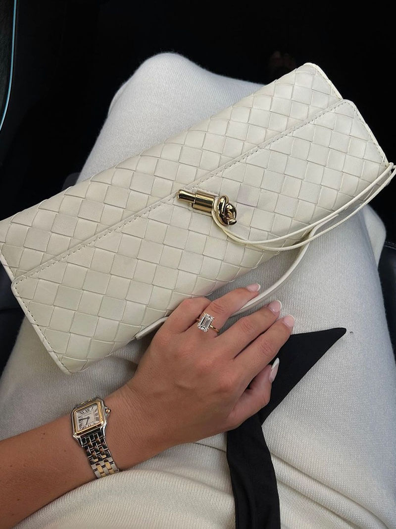 Stylish faux leather woven clutch for women, featuring a unique knot closure.